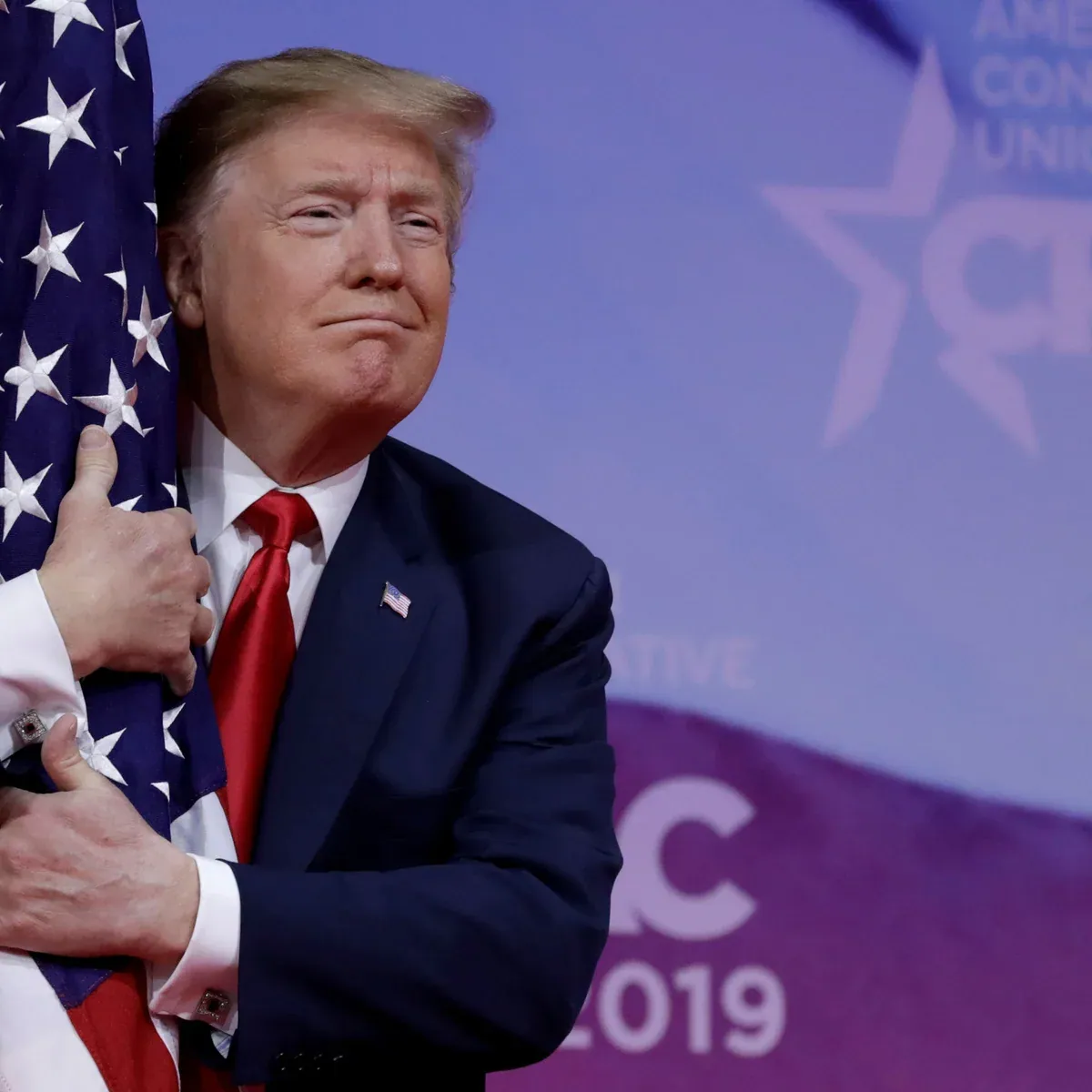 President Donald Trump speaking at a podium.
