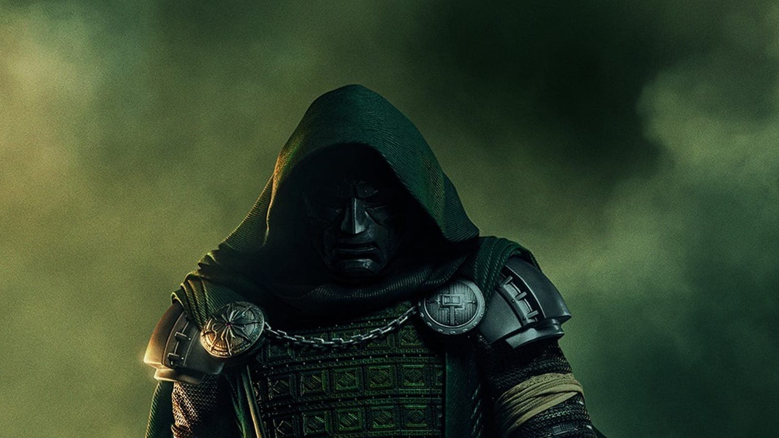 Doctor Doom in a hooded green cloak and metal armor on the Avengers: Doomsday poster.