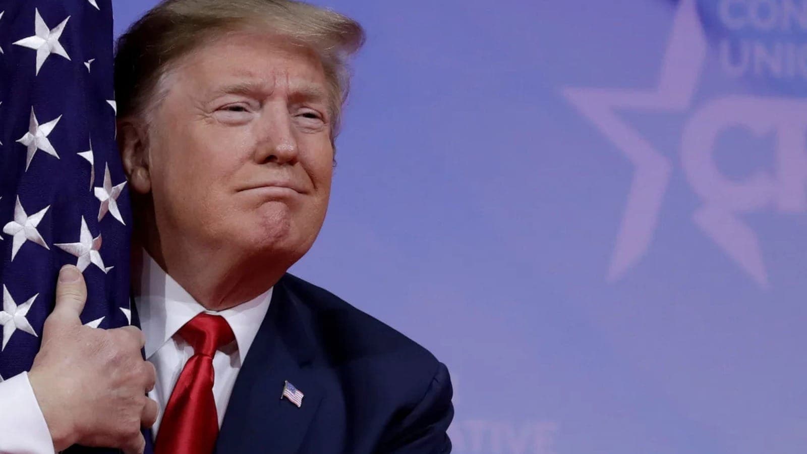 President Donald Trump speaking at a podium.