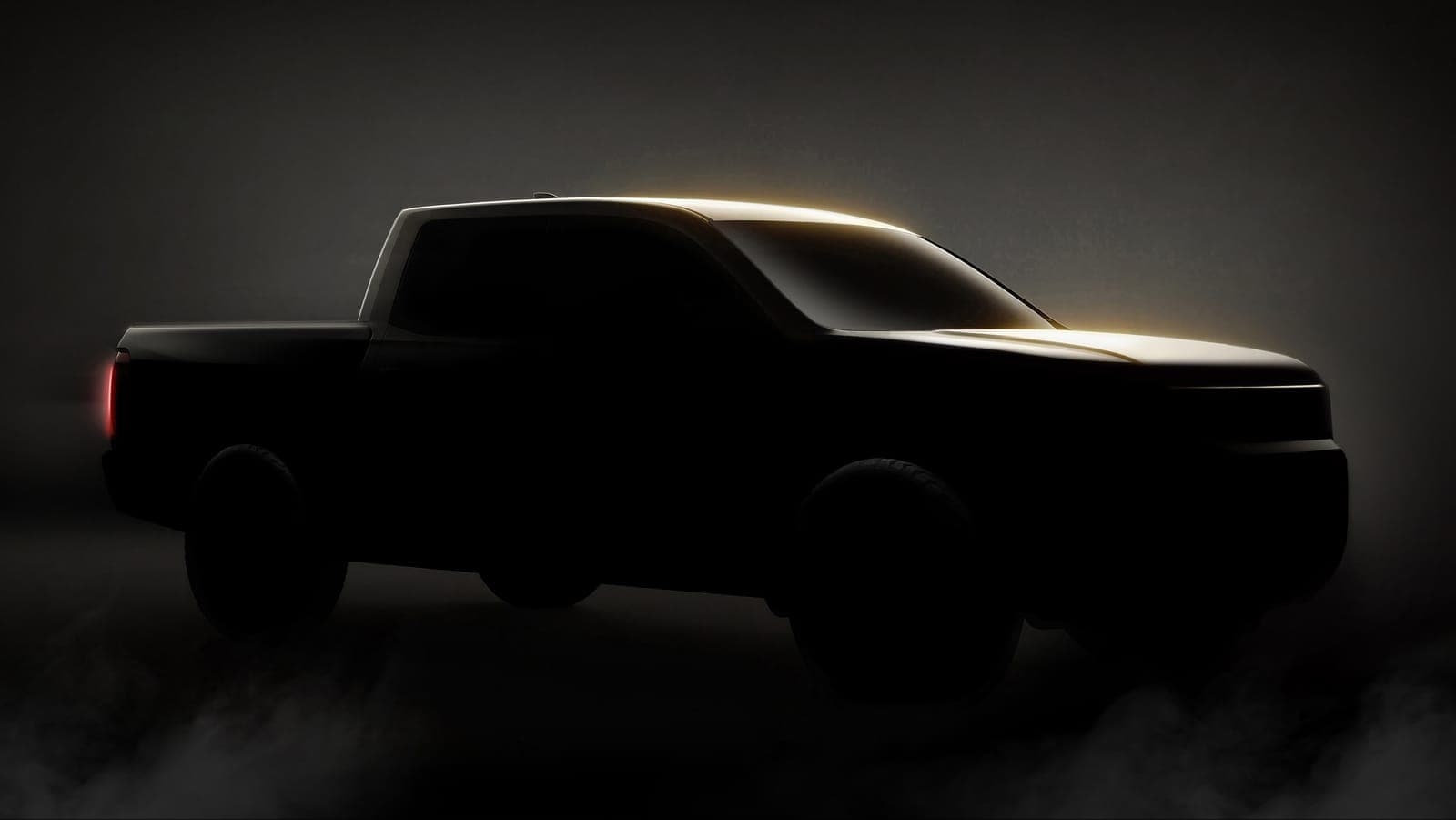 Shadowed teaser image of the next-generation Honda Ridgeline pickup in profile.