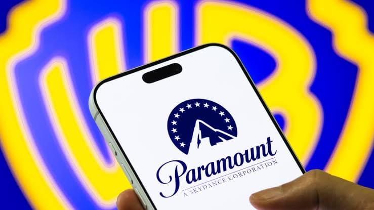 A smartphone displaying the Paramount logo against a blue and yellow background.