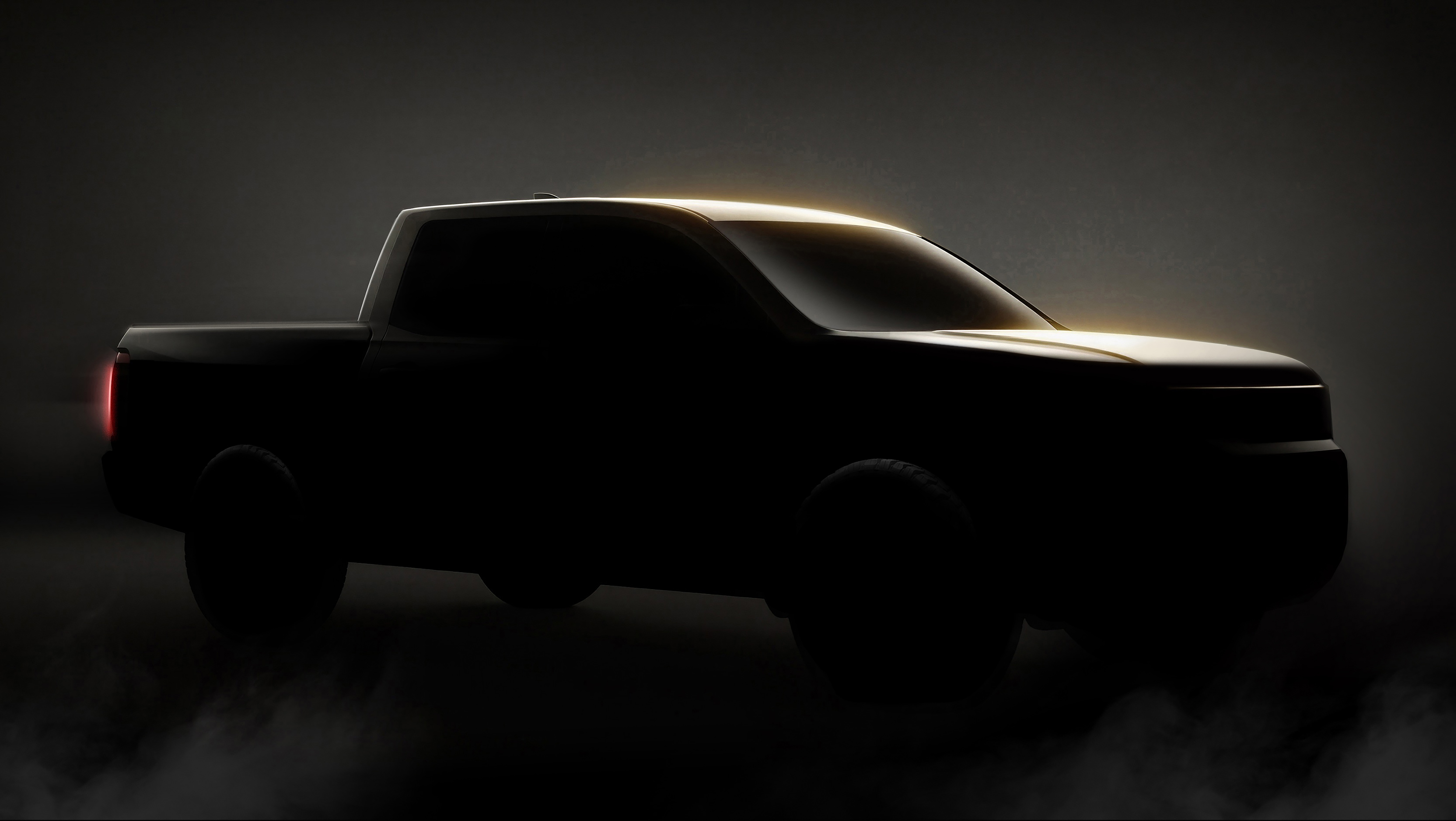 Shadowed teaser image of the next-generation Honda Ridgeline pickup in profile.