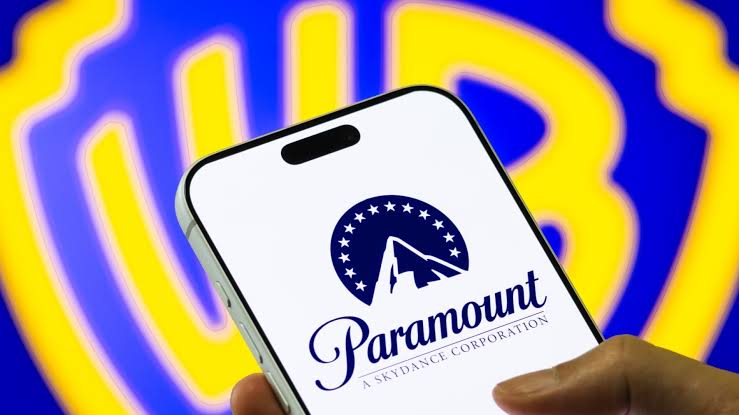 A smartphone displaying the Paramount logo against a blue and yellow background.